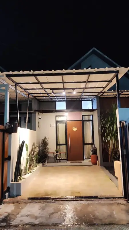 Carport dengan kanopi spandek dan taman kering